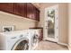 Laundry room with washer, dryer, and exterior access at 21525 E Camacho Rd, Queen Creek, AZ 85142