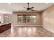 Spacious living room with tile floors and large windows offering natural light at 21525 E Camacho Rd, Queen Creek, AZ 85142