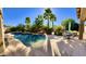 Inviting kidney shaped pool with waterfall feature at 21525 E Camacho Rd, Queen Creek, AZ 85142