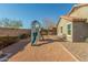 Backyard with playset and gravel landscaping at 2185 E Hazeltine Way, Gilbert, AZ 85298