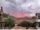 Backyard view with mountain backdrop, playset and sunset at 2185 E Hazeltine Way, Gilbert, AZ 85298