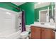 Clean bathroom with a tub, toilet and modern vanity at 2185 E Hazeltine Way, Gilbert, AZ 85298