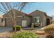 Single-story home with a two-car garage and seating area at 2185 E Hazeltine Way, Gilbert, AZ 85298