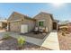 Single-story home with a two-car garage and landscaped yard at 2185 E Hazeltine Way, Gilbert, AZ 85298