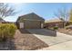 Single story home with a two-car garage and gravel driveway at 2185 E Hazeltine Way, Gilbert, AZ 85298