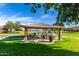 Gazebo with picnic tables near lake at 2185 E Hazeltine Way, Gilbert, AZ 85298