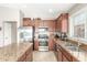 Spacious kitchen with stainless steel appliances and granite countertops at 2185 E Hazeltine Way, Gilbert, AZ 85298