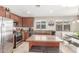 Kitchen island with granite countertop and seating for two at 2185 E Hazeltine Way, Gilbert, AZ 85298