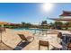 Community pool with lounge chairs and tables at 2185 E Hazeltine Way, Gilbert, AZ 85298