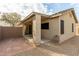 Artificial turf and a covered patio are featured in this home's backyard at 2298 E Hazeltine Way, Chandler, AZ 85249