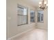 Dining area with large windows and chandelier at 2298 E Hazeltine Way, Chandler, AZ 85249