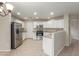 Modern kitchen with stainless steel appliances and light wood floors at 2298 E Hazeltine Way, Chandler, AZ 85249