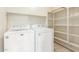 Laundry room with washer, dryer, and shelving at 2298 E Hazeltine Way, Chandler, AZ 85249