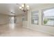 Bright living room with hardwood floors, ceiling fan, and sliding glass door at 2298 E Hazeltine Way, Chandler, AZ 85249