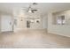 Open living room with kitchen view and laminate floors at 2298 E Hazeltine Way, Chandler, AZ 85249