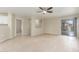 Living room with sliding glass doors and ceiling fan at 2298 E Hazeltine Way, Chandler, AZ 85249