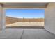 View of the backyard from the covered back patio overlooking low maintenance landscaping at 2324 W Moody Trl, Phoenix, AZ 85041