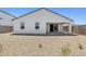 Expansive backyard is landscaped with gravel, a small tree, and features a covered patio at 2324 W Moody Trl, Phoenix, AZ 85041