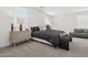 Bright bedroom featuring a comfortable bed, stylish nightstands, and an inviting seating area at 2324 W Moody Trl, Phoenix, AZ 85041