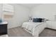 Bright bedroom with plush carpet, large window with blinds, and tasteful modern decor at 2324 W Moody Trl, Phoenix, AZ 85041