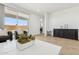 Open-concept living area with sliding glass doors and a stylish accent table at 2324 W Moody Trl, Phoenix, AZ 85041
