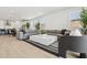 Spacious living room with a large gray sectional and ample natural light at 2324 W Moody Trl, Phoenix, AZ 85041