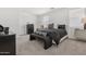 Modern main bedroom featuring a comfortable bed with stylish decor and neutral tones throughout at 2324 W Moody Trl, Phoenix, AZ 85041