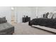 Stylish main bedroom with a gray color palette, a luxurious bed, and plenty of space at 2324 W Moody Trl, Phoenix, AZ 85041