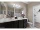 Double vanity bathroom with large mirror and adjacent closet at 240 W Juniper Ave # 1173, Gilbert, AZ 85233