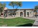 Community clubhouse with surrounding green space at 240 W Juniper Ave # 1173, Gilbert, AZ 85233