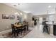 Bright dining area with a wooden table and black chairs at 240 W Juniper Ave # 1173, Gilbert, AZ 85233