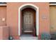 Inviting front entrance with arched entryway and tasteful landscaping at 240 W Juniper Ave # 1173, Gilbert, AZ 85233