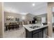 Granite kitchen island with sink and bar seating at 240 W Juniper Ave # 1173, Gilbert, AZ 85233