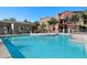 Inviting community swimming pool with surrounding patio at 240 W Juniper Ave # 1173, Gilbert, AZ 85233