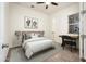 Bedroom with queen bed and built-in desk at 24018 N 165Th Dr, Surprise, AZ 85387