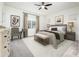 Main bedroom with king-size bed, and ample natural light at 24018 N 165Th Dr, Surprise, AZ 85387