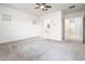 Spacious bedroom with carpeted floor and ceiling fan at 24018 N 165Th Dr, Surprise, AZ 85387