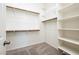 Large walk-in closet with shelving and hanging rods at 24018 N 165Th Dr, Surprise, AZ 85387