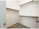 Walk-in closet with hanging rods and shelving at 24018 N 165Th Dr, Surprise, AZ 85387