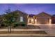 Single-story home with a two-car garage and well-maintained landscaping at 24018 N 165Th Dr, Surprise, AZ 85387