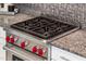 Stainless steel gas cooktop with four burners and red control knobs at 24018 N 165Th Dr, Surprise, AZ 85387