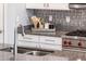 Kitchen features granite countertops and a farmhouse-style sink at 24018 N 165Th Dr, Surprise, AZ 85387