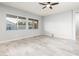 Bright and airy living room with large windows and tile floors at 24018 N 165Th Dr, Surprise, AZ 85387