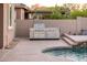 Built-in stainless steel grill near the pool at 24018 N 165Th Dr, Surprise, AZ 85387