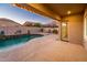 Covered patio with string lights overlooks pool at 24018 N 165Th Dr, Surprise, AZ 85387