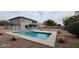 Inviting backyard with refreshing pool and spacious patio at 2463 W Morning Sun Cir, San Tan Valley, AZ 85144