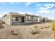 New home with covered patio and gravel backyard at 26448 W Kimberly Way, Buckeye, AZ 85396