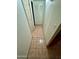 Clean hallway with tile flooring and doors leading to other rooms at 2645 W Wolf St, Phoenix, AZ 85017