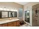 Elegant bathroom with dual sinks, a large shower, and a glass enclosure at 26616 N 42Nd Way, Cave Creek, AZ 85331