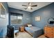 Cozy bedroom with a full-size bed and a calming blue color scheme at 26616 N 42Nd Way, Cave Creek, AZ 85331